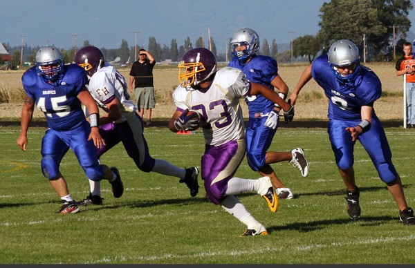 Roy Taylor (No. 33) gains some yardage for the Friday Harbor Wolverines