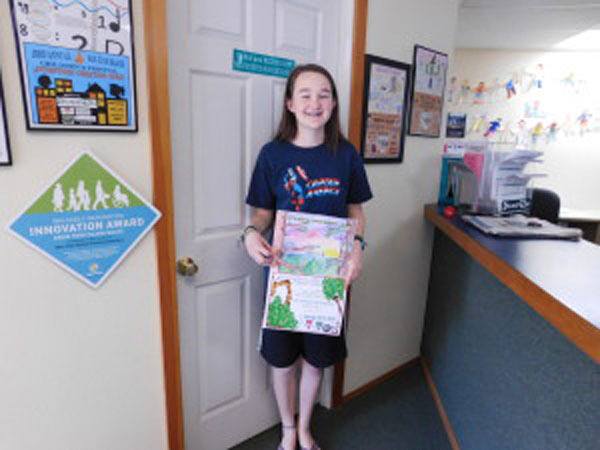 Emily Fitts is the poster contest winner for the 26th Annual Island Rec Children's Festival