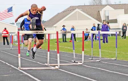 2015 state 2B hurdles champ Willie Blackmon takes the lead in a 300-meter hurdle heat in 2014.