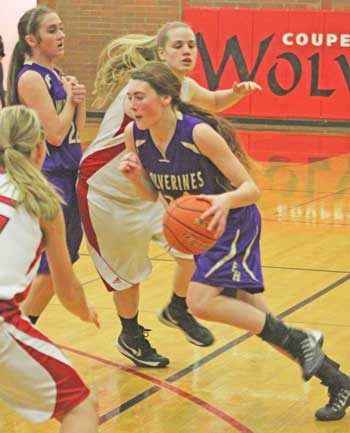 Friday Harbor's Madi Kincaid takes advantage of an opening in the Coupeville defense with the help of a screen by teammate Lili Wood.