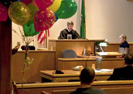 The late Judge John O. Linde presides over San Juan County Superior Court's first National Adoption Day celebration. Superior Court will host its second Adoption Day  event on Friday