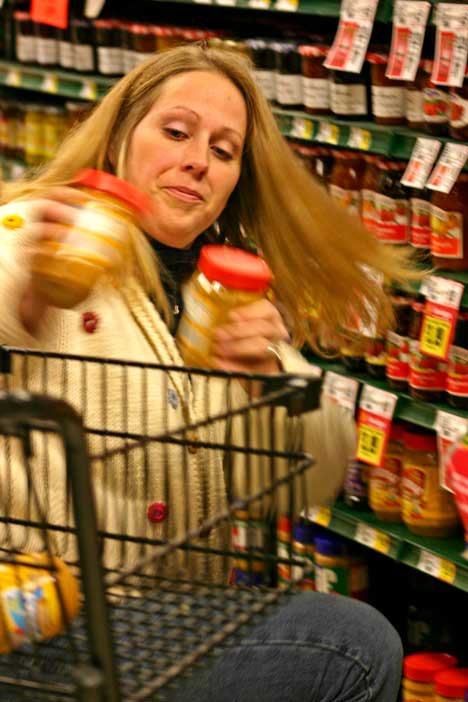 Friday Harbor's Rusty Argall makes sure peanut butter is part of the haul during the holiday shopping spree sponsored by the San Juan Lions Club. Argall