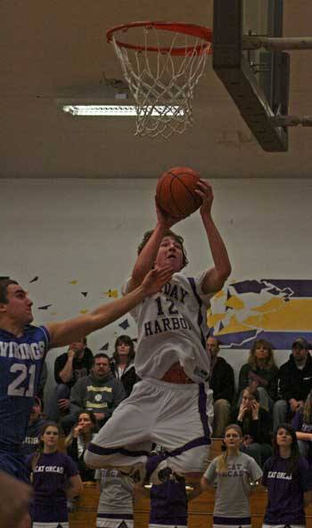 Friday Harbor's Donald Galt lays an alley-oop up and in