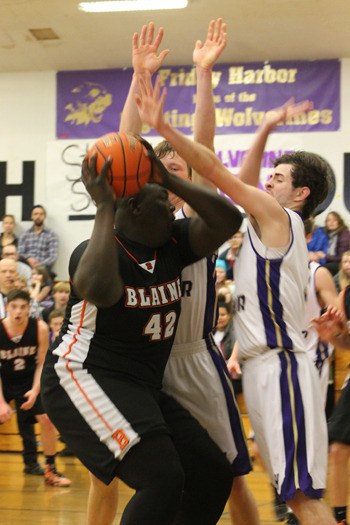Gabe Lawson and Dylan DeMaris team up to defend down low against Blaine 6’ 4” sophomore Shaquille Wood.