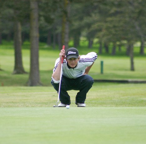 Cody Price sizes up a putt during a 2009 tournament at San Juan Golf and Country Club. The former Friday Harbor High School golf standout