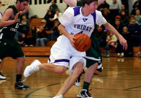 Friday Harbor sophomore Donny Galt drives to hoop in the Wolverines come-from-behind 59-56 victory over Shoreline Christian