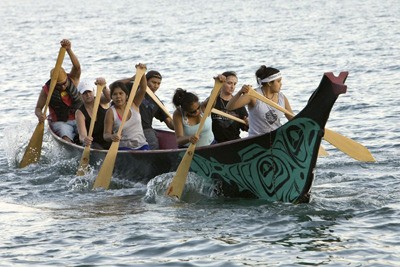 Paddlers ply the waters of the Coast Salish Sea as part of an earlier Inter-Tribal Canoe Journey. Paddlers and canoes of the Lummi Nation will make a stop-over in Friday Harbor July 22 as part of this year's canoe journey.