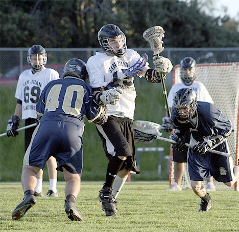 Westin Hedin powers past two North County defenders in the Dragons’ 12-4 victory