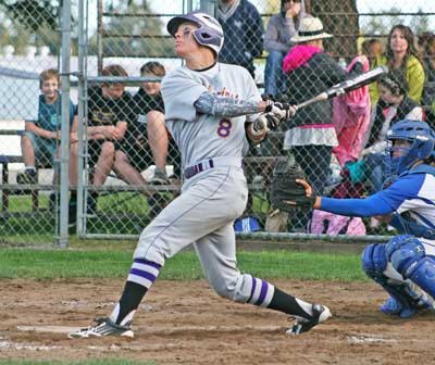 Friday Harbor's Peter Holt fouls off a pitch in May 1 league game at home against La Conner. Holt had three base hits and drove in two runs in the Wolverines regular-season finale