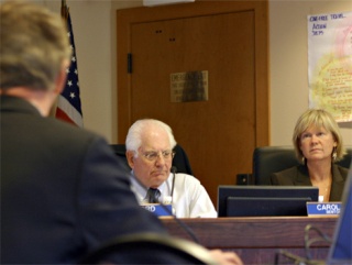 Richard Ford and Carol Moser of the state Transportation Commission ponder the fate and funding woes of the state ferry system as transportation specialist Steve Pickerell of Cambridge Systematics presents an analysis of the agency’s finances
