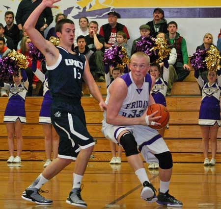 Friday Harbor’s Collin Williamson drives the baseline in search of a two-point shot down low in the Wolverines loss at home