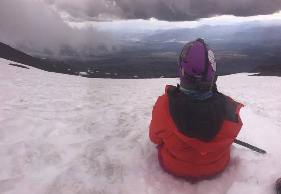 Staff photo/ Cali BagbyClimber Cat Fabian watches the clouds lift as she descends Mt. Adams.