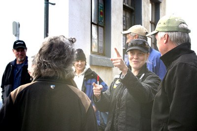 Erin Corra talks with a visitor at the annual Orca Sing at Lime Kiln.