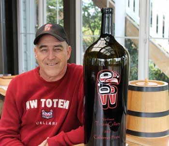 Mike Sheradin and a collector’s size bottle of his Northwest Totem Cellars 2004 Cabernet Franc.