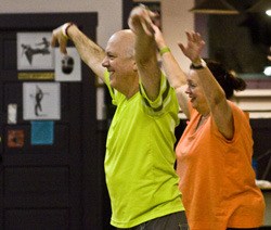 Bill and Rita Ament showing off their “Zumba” moves in a class at Dance Workshop II.
