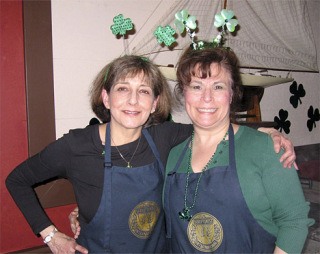 St. Patrick’s Day event chairwomen Becki Day and Debbi Staehlin invite you to wear your green — and bring your green — to the auction-dinner. You’ll raise money for scholarships and other local services.