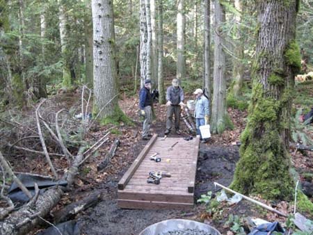 The “puncheon” shown above was installed Dec. 3 on Mitchell Hill’s Kneeknocker Trail. It spans a portion of the trail saturated by a thin stream of seasonal water runoff.