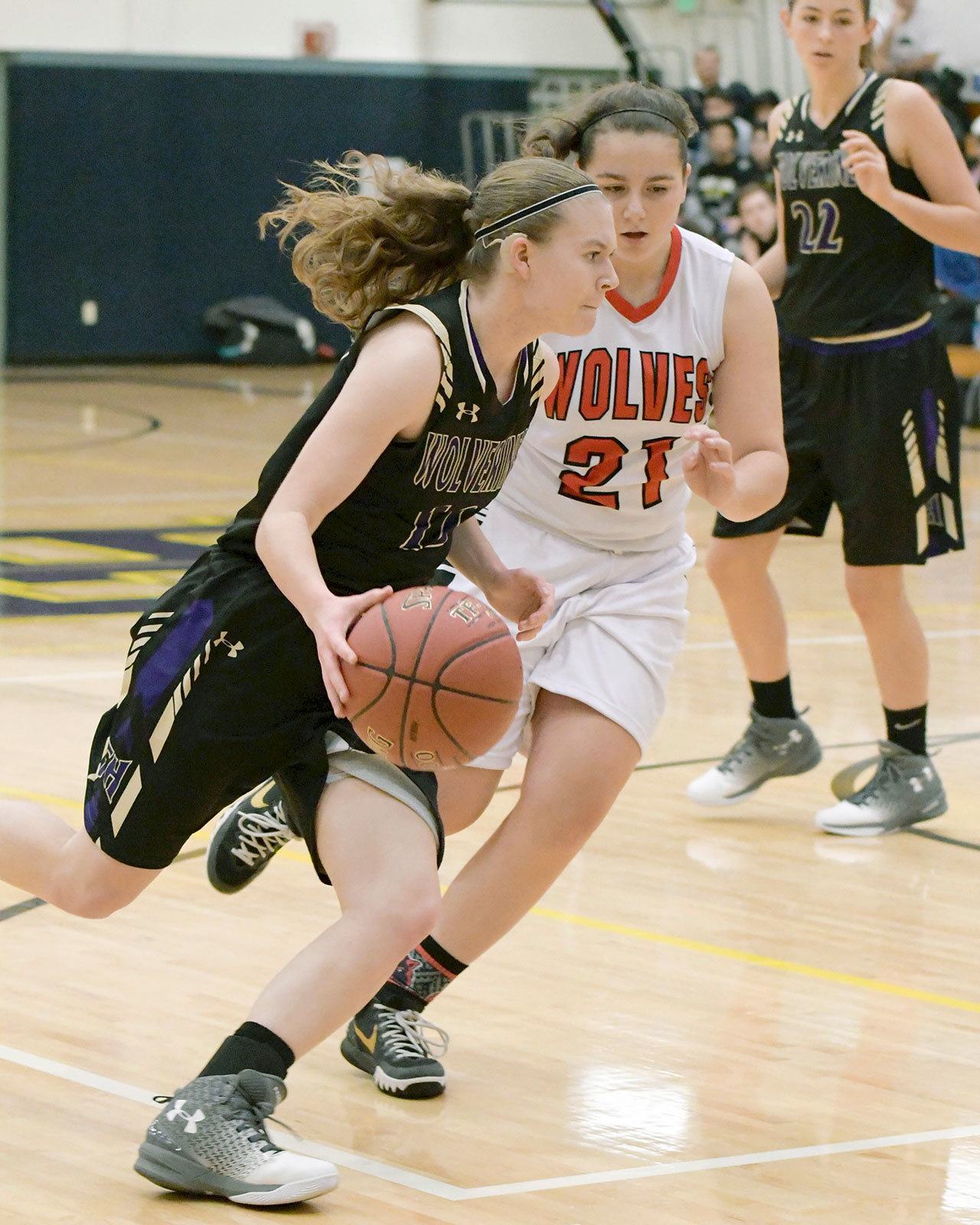 Contributed photo/Aaron Shepard                                Junior Sierra Bailey dribbles past a Coupeville Wolf.