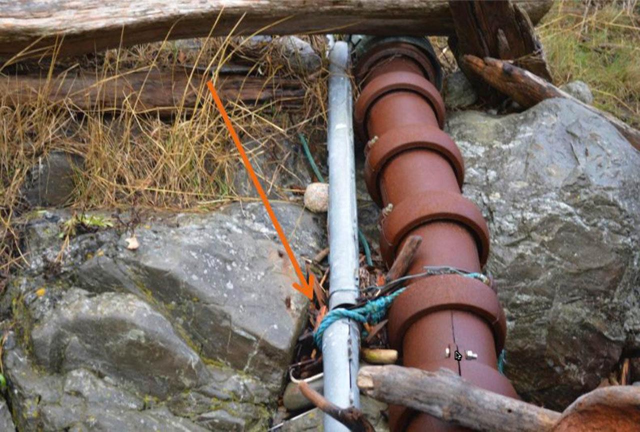 Contributed photo/Public records request                                CenturyLink’s fiber cable is connected to OPALCO’s power cable with rope and wire near OPALCO’s Pear Point substation.