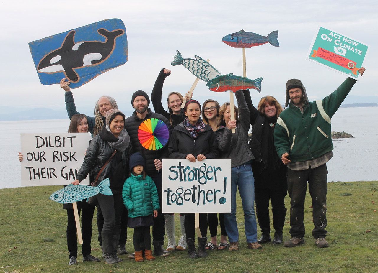Staff photo/Hayley Day                                About 150 islanders rallied at the San Juan County Park against the Kinder Morgan Trans Mountain pipeline expansion. “Stopping the expansion is the most important thing we can do to protect the environment,” said Eben Shay, in the green jacket to the right.