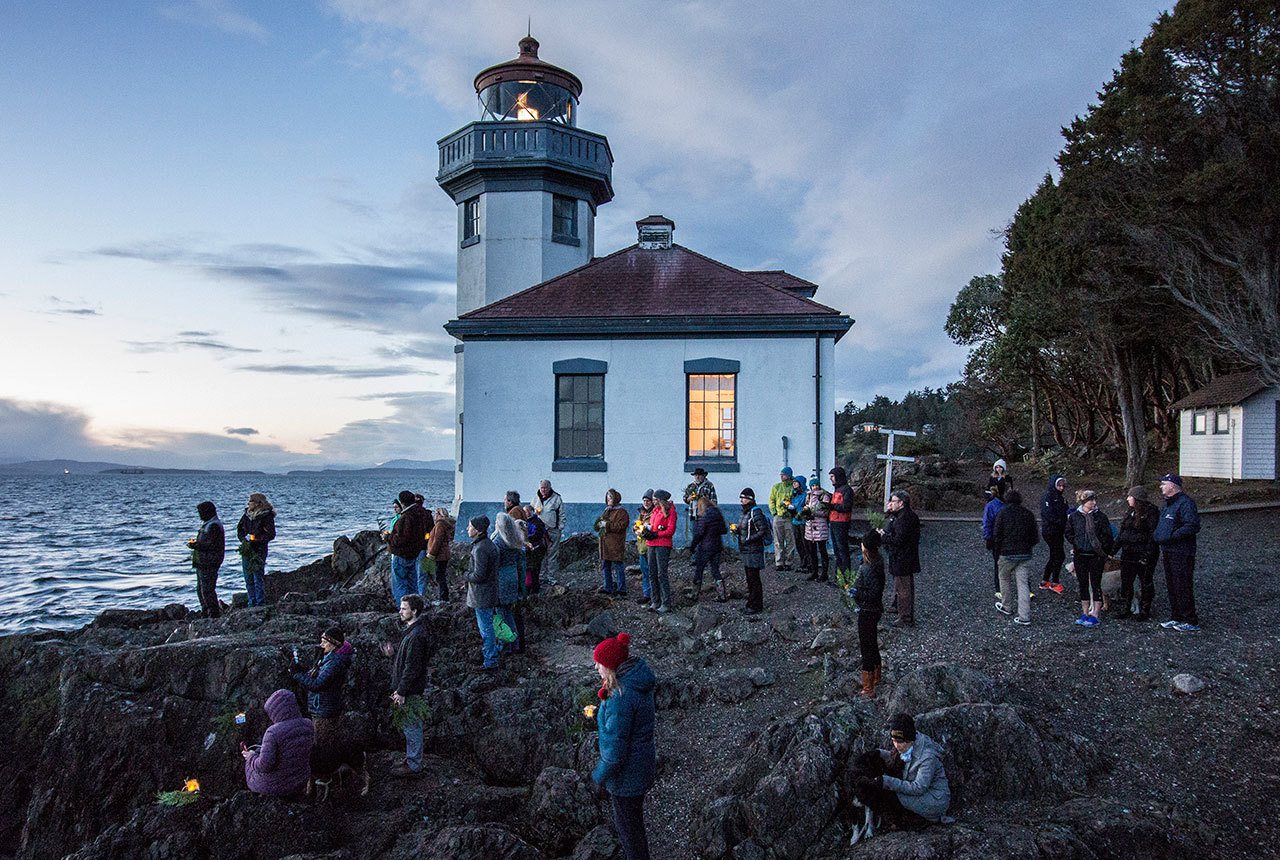 Staff photo/Greg Sellentin                                About 40 people gathered at the Lime Kiln lighthouse to honor the Salish Sea’s orcas who passed in 2016.