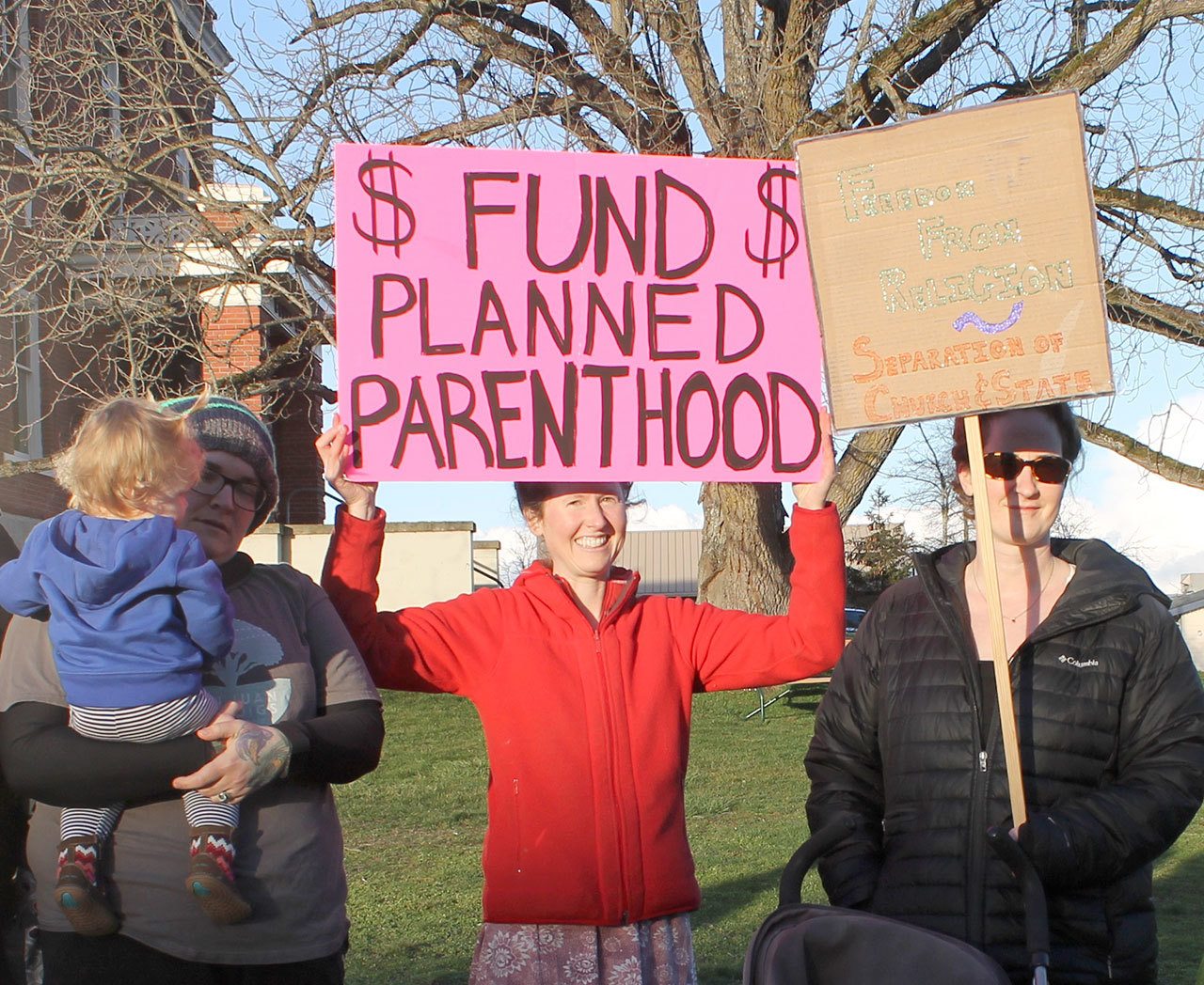 Staff photo/Hayley Day                                A handful of islanders gathered outside the Feb. 22 SJCPHD No. 1 meeting to protest for and against funding Planned Parenthood with taxpayer money.