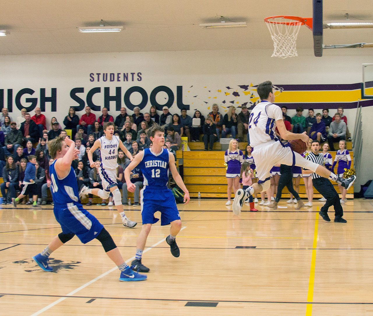 Staff photo/Greg Sellentin                                Senior Jake Lowe scores on a breakaway layup.