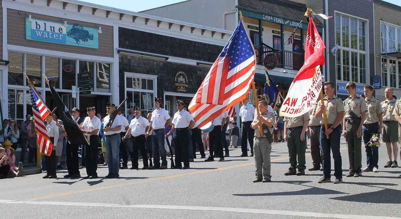 Staff photo/Hayley Day                                American Legion Post 163 marches down Spring Street during the Memorial Day parade.