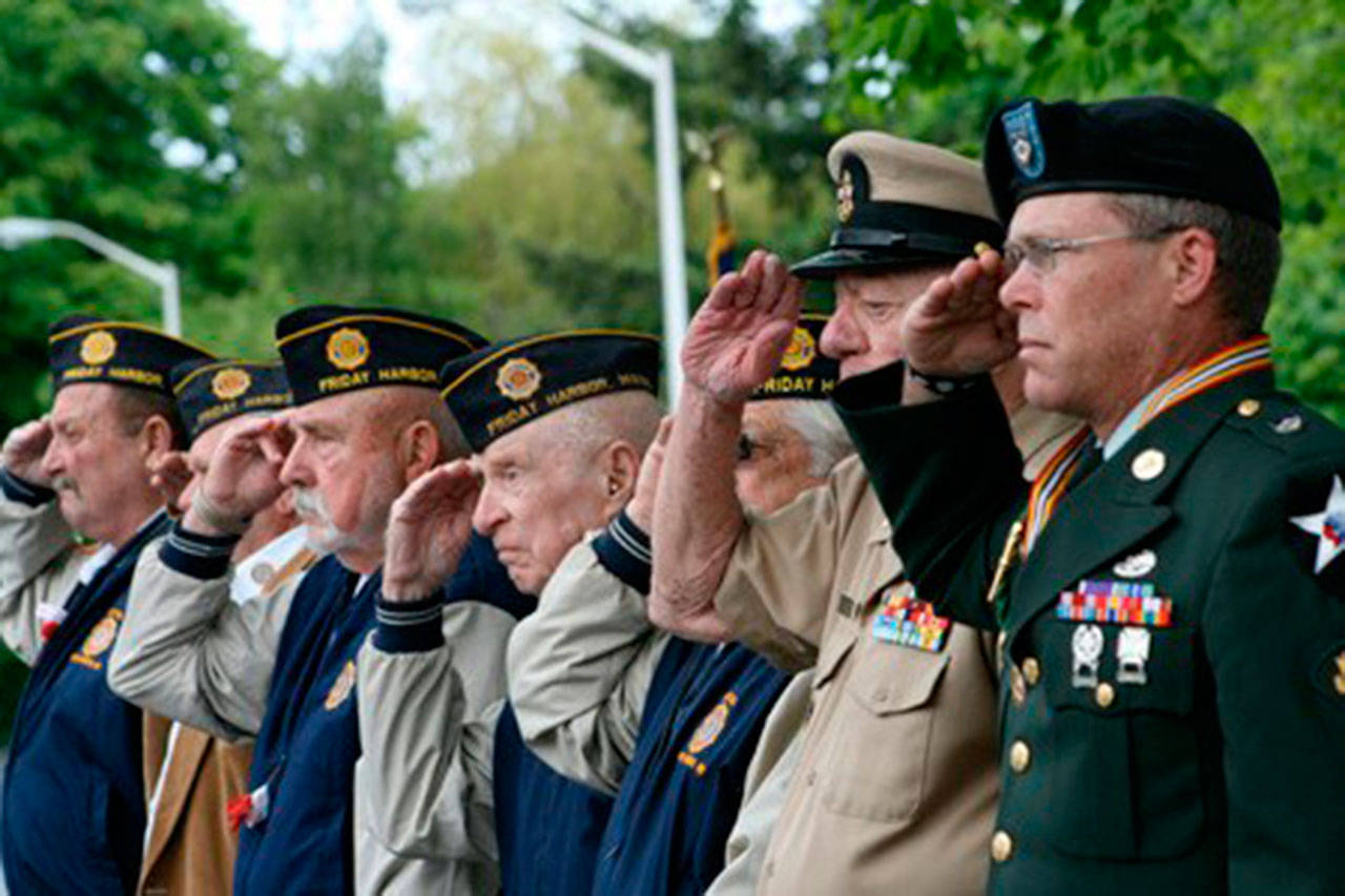 Staff photo                                Veterans salute during the 2014 Memorial Day parade in Friday Harbor.