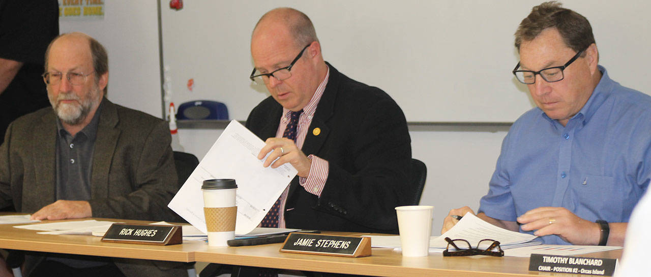 Staff photo/Hayley Day                                San Juan County Councilmen review public comment from an islander at the June 16 public hearing on the comprehensive plan&rsquo;s population projection.