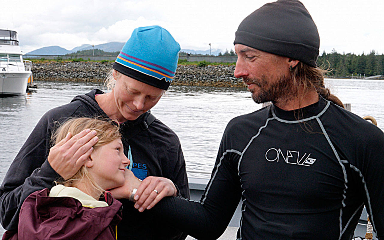 Contributed photo/ Kyle Carver                                Karl Kruger with wife Jessica and daughter Dagney at the end of the Race to Alaska.