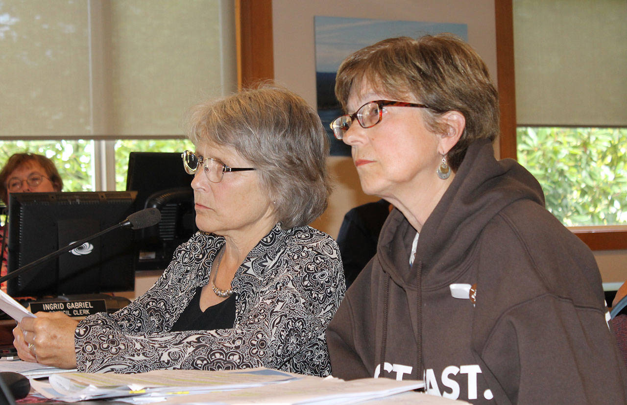 Staff photo/Hayley Day                                Eleanor Hoague of Orcas, who wrote the initiative, and Judy Scott of Orcas answer council’s questions at the Aug. 15 public hearing.