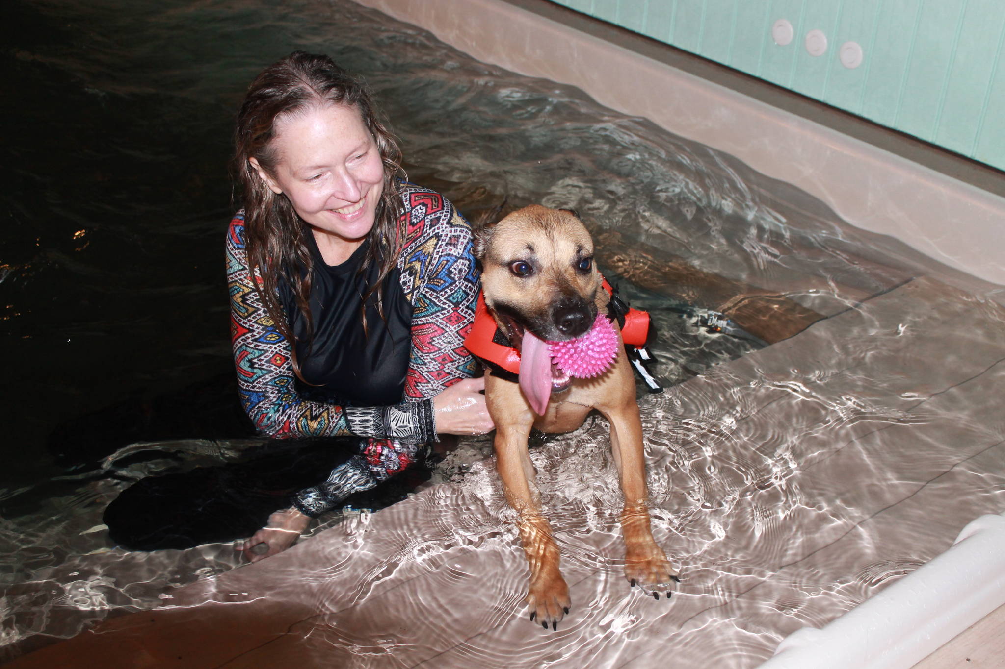 Staff photo/Heather Spaulding                                Terri Dowell and Addi at Skookum Dog Rehabilitation and Fitness.