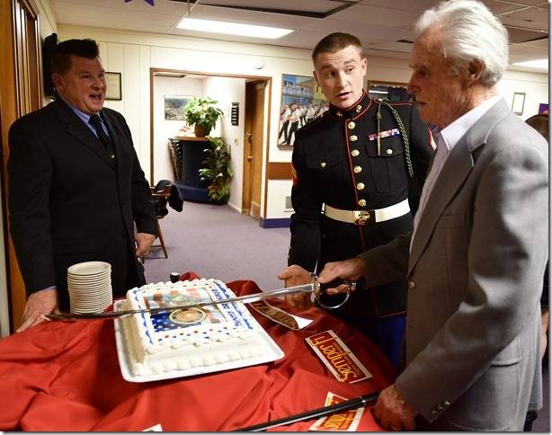 Contributed photo/ Bill Waxman                                One of the island’s youngest Marines, Josh Boudreau and oldest Marines Dave Woodall cut the cake.