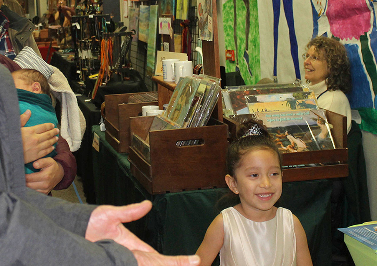 Staff photo/Hayley Day                                A small shopper peruses the Holiday Market at the Friday Harbor Elementary School on Nov. 25.