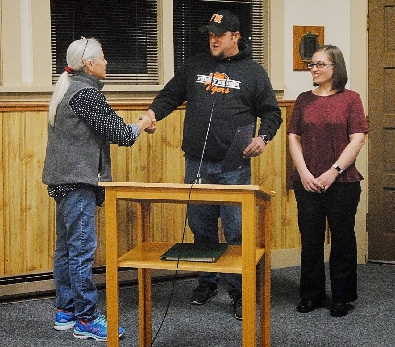 Staff photo/Tate Thomson                                Mayor Carrie Lacher (left) hands over the proclamation to Kasey Anderson (middle) and Bethany Berry (right).