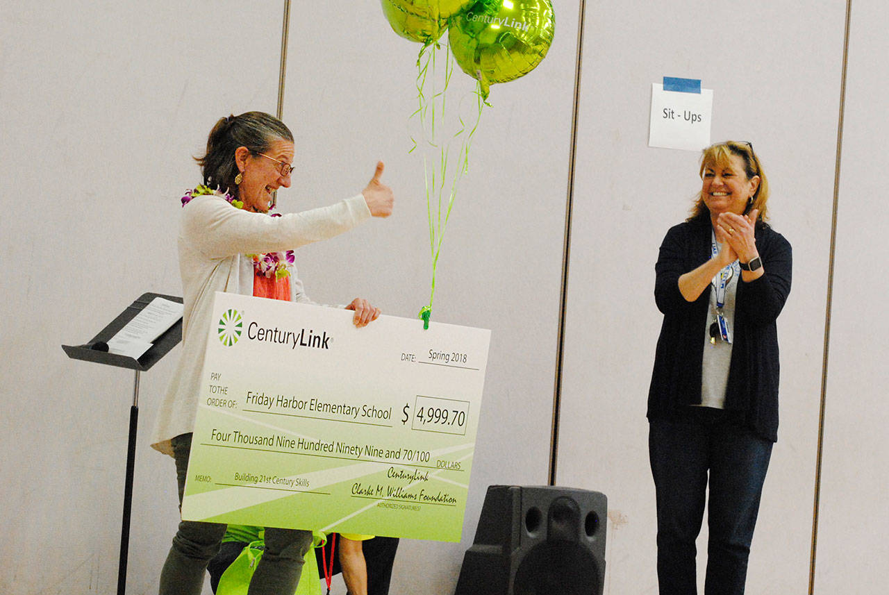 Staff photo/Tate Thomson                                FHES teacher Susan Kareken receives the check.