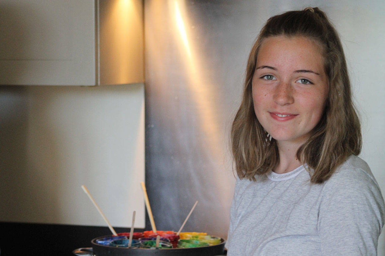 Staff photo/Hayley Day                                Meg Strehlou stands in the kitchen with remnants of melted crayons on the stove.