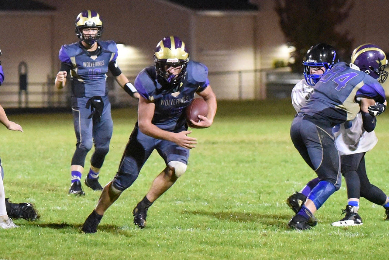 Contributed photo/John Stimpson                                Powerhouse running back, Emeron Geiser, No. 41, takes off up the middle for a big gain on a play. He scored the only touchdown of the game, giving Friday Harbor the win.