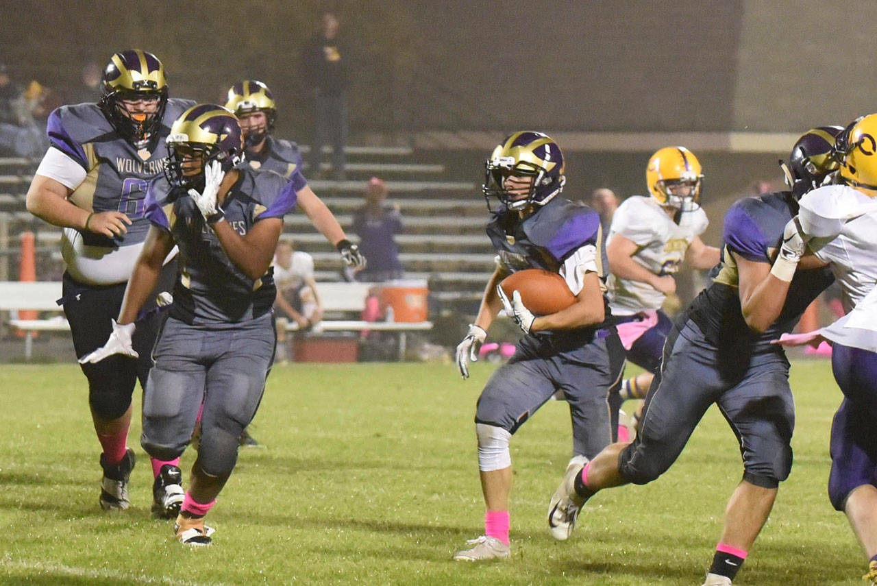 Contributed photo/John Stimpson                                Wolverine Matro Blackmon and others continue to clear the way for Kyson Jackson running up the middle.