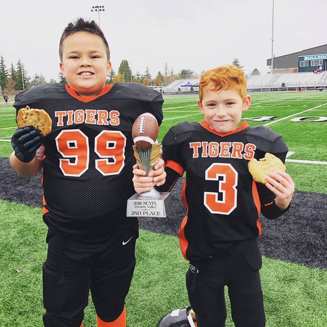 Contributed photo                                Tigers peewees Boaz Moses and Kash Griffith hold the team’s second place trophy for their division.
