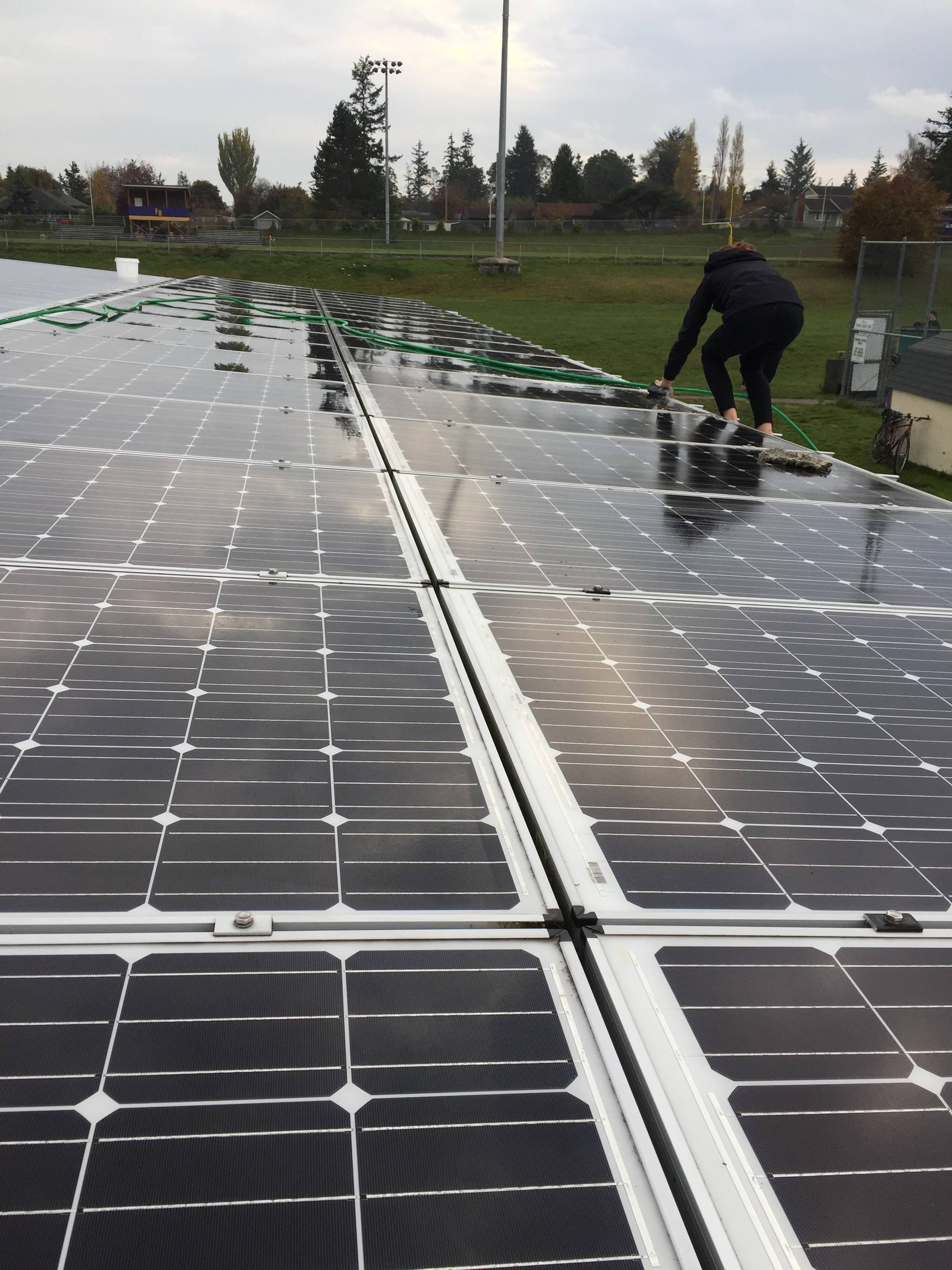 Contributed photo                                Rachel and Molly cleaned the STEM building’s solar panels as part of their community project.