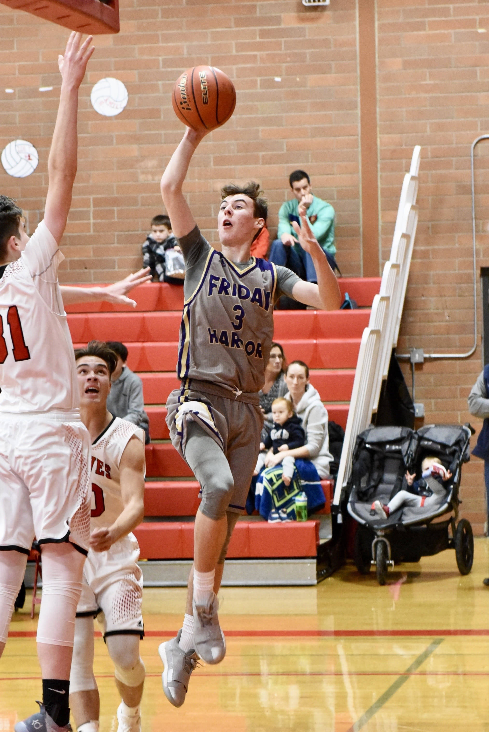 Contributed photo/John Stimpson                                Lucas Chevalier makes a jumper from the baseline for 2 more points.