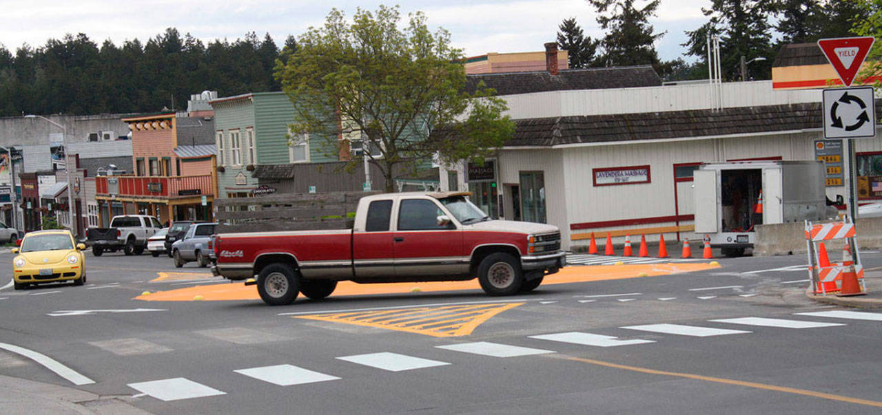 Staff photo/Hayley Day                                A driver makes his way through Friday Harbors painted roundabout after it first opened in May.