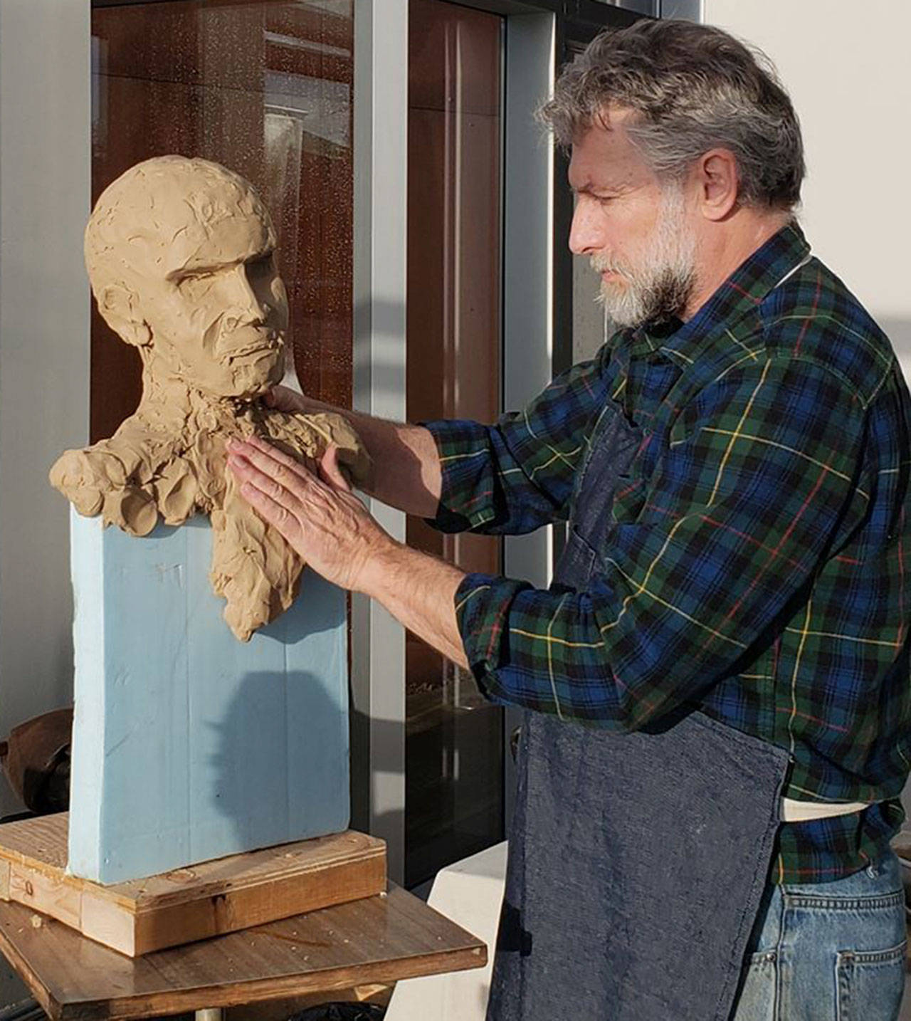 Contributed photo/SJIMA                                Gareth Curtiss sculpts the face of the statue.