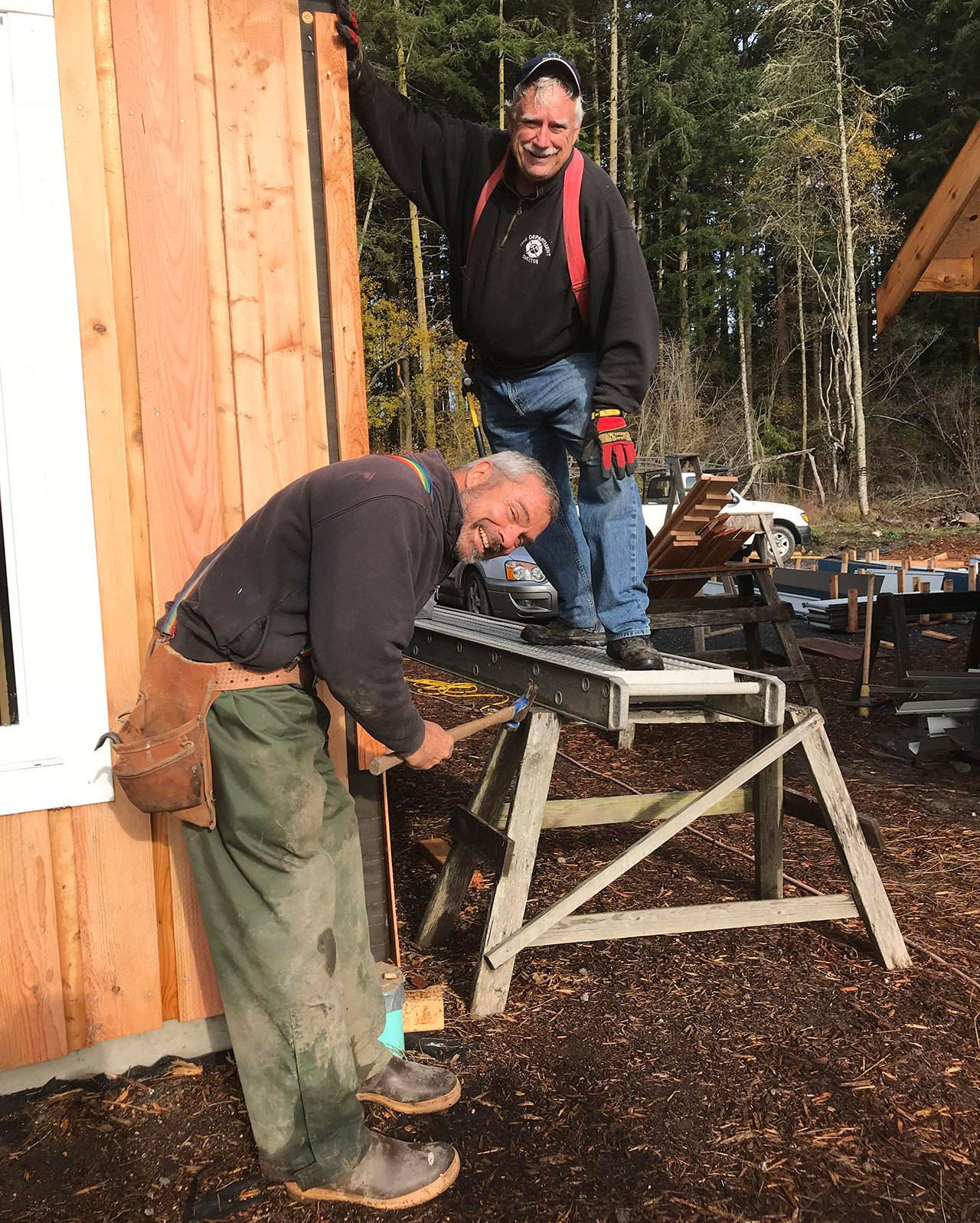 Contributed photo/Sandy Bishop                                Lopez Community Land Trust volunteers Jim and Tom help with the organization’s 2018 Salish Way project.