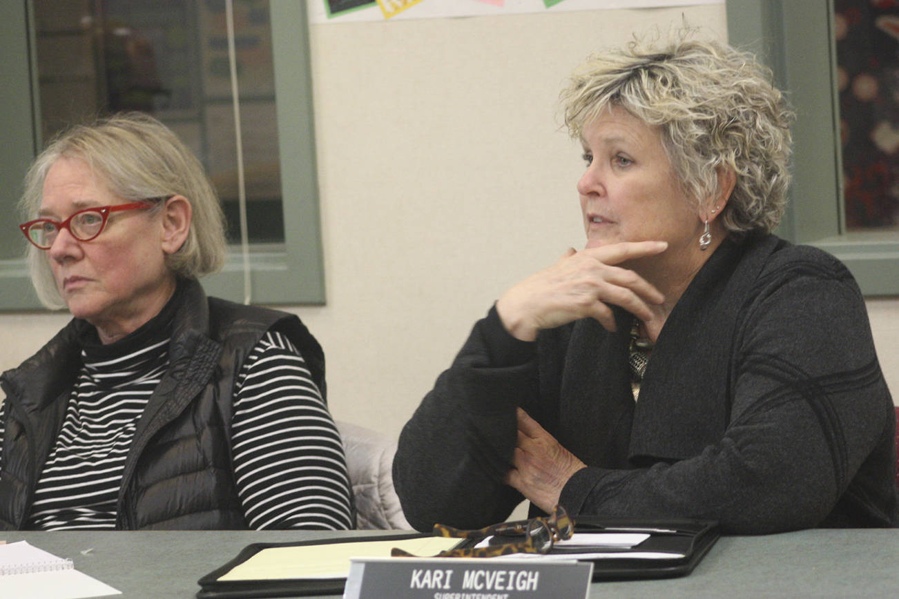 Staff photo/Hayley Day                                Board member Barbara Bevens and interim superintendent Kari McVeigh listen to attendees.