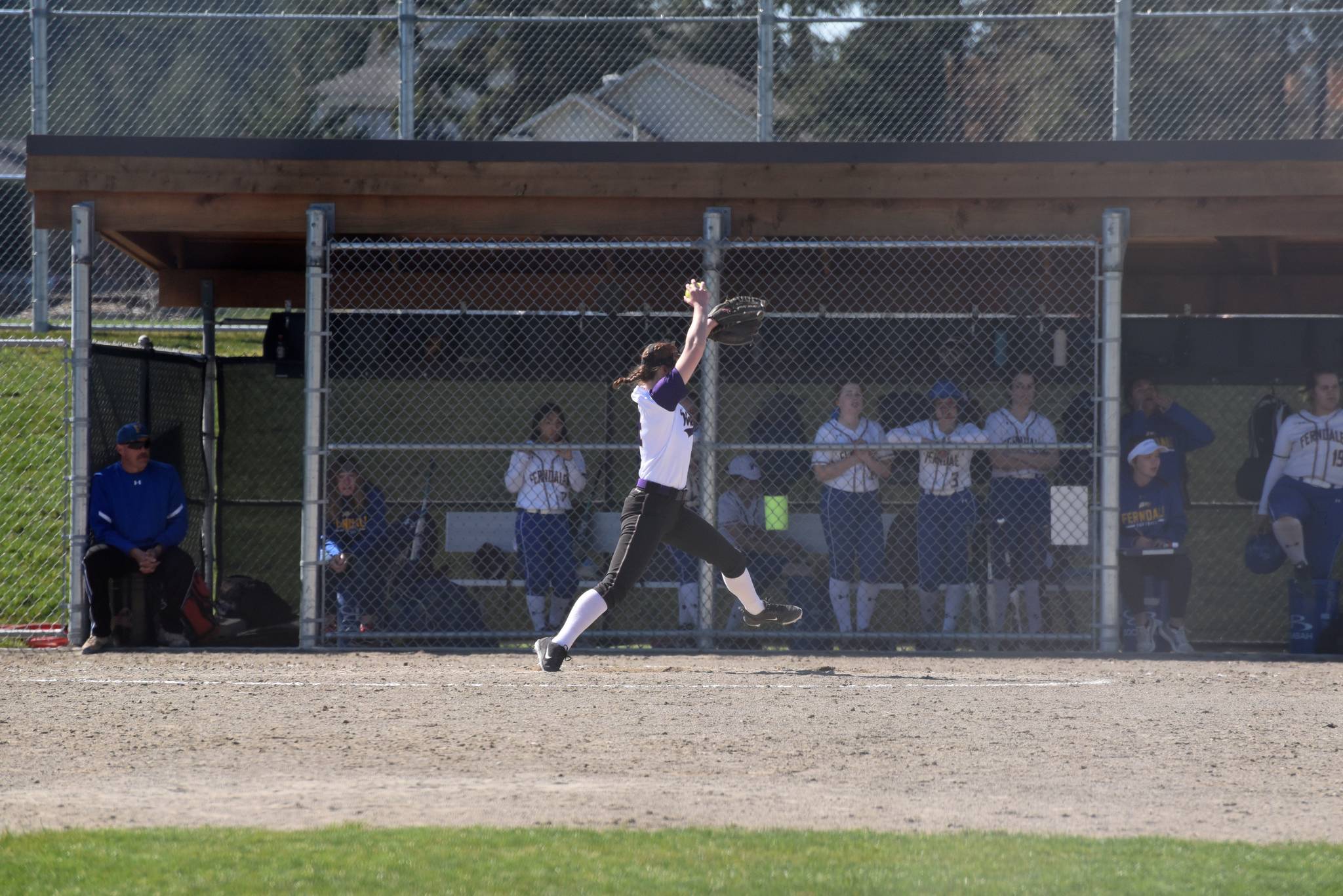 Staff photo/Tate Thomson                                Pitcher Grace Pauls throws ball to Jayna Ott on first.