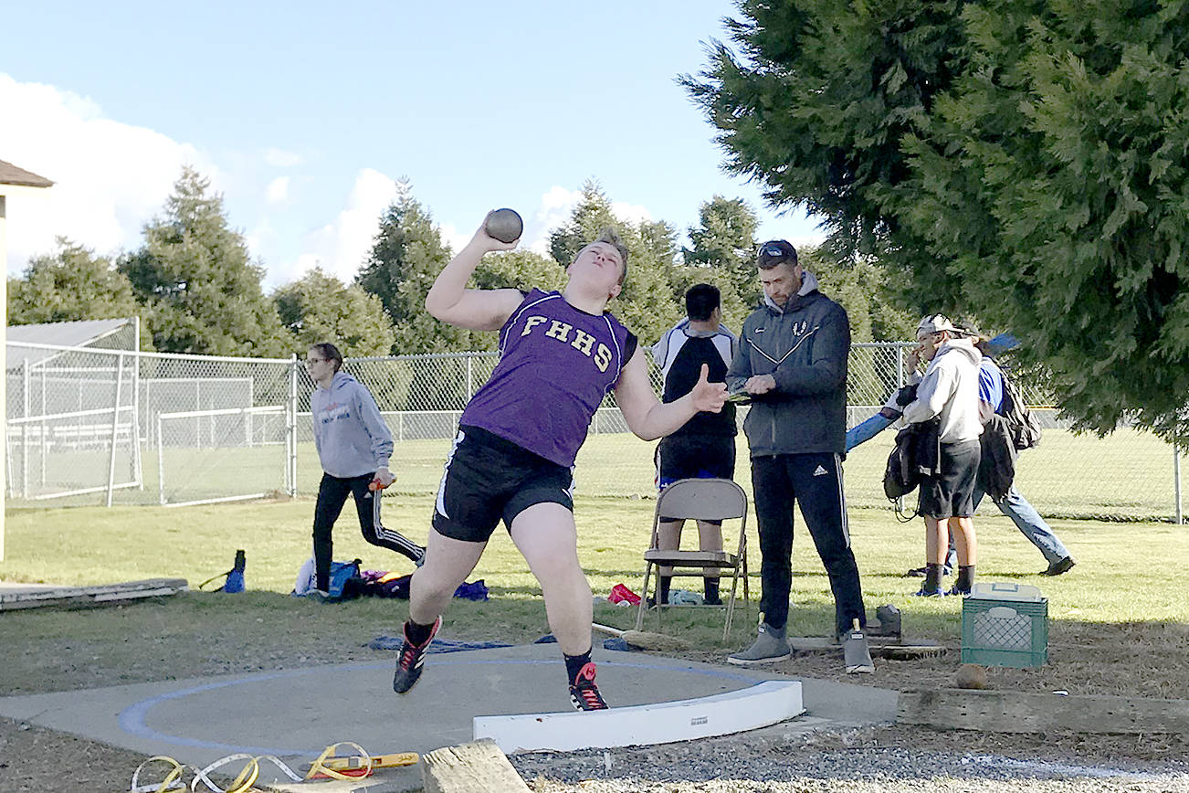 Contributed photos/LeeAnn Russell                                Arlo Harold throwing shot put