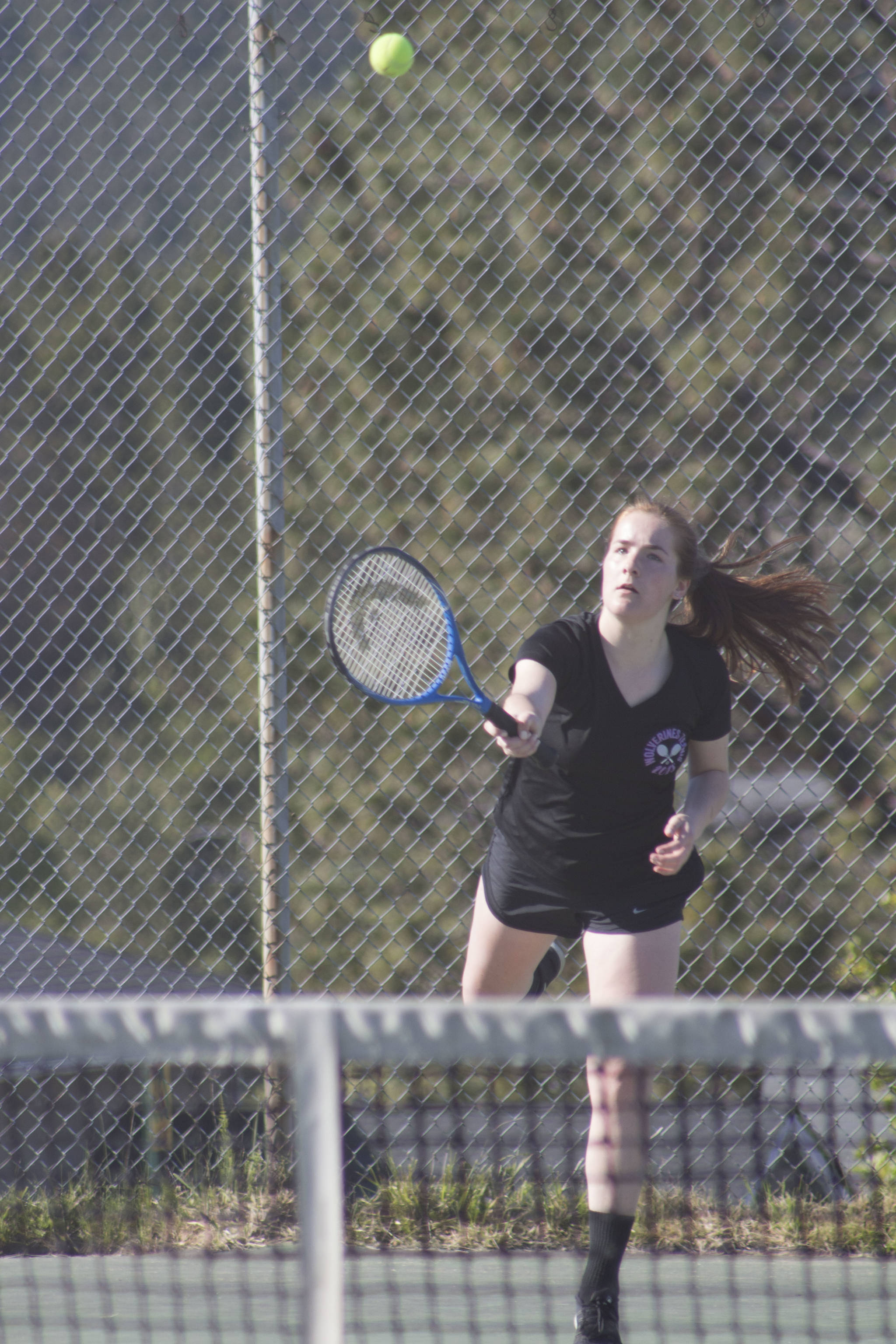 Staff photo/Heather Spaulding. Katy Kulseth finishes a serve.
